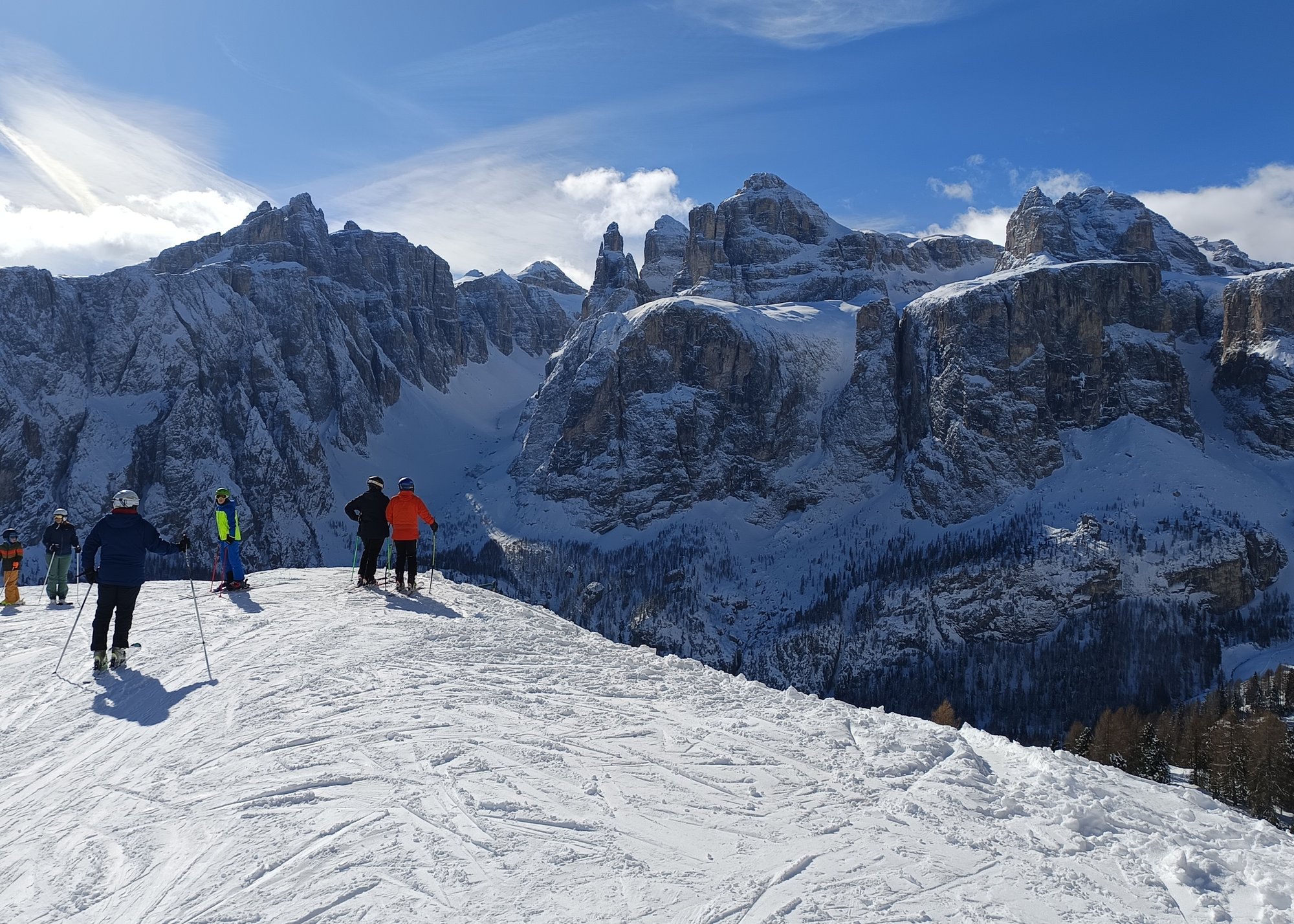 Panoramic Olympic era piste above Cortina d'Ampezzo in bright winter sun